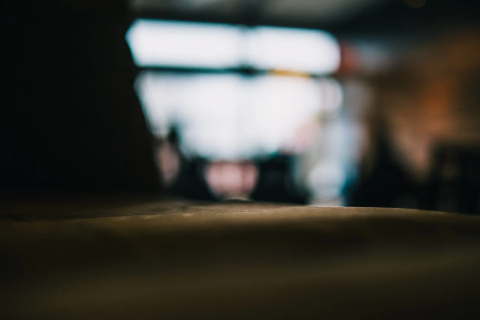 Blurred interior of a dim room with light from the windows